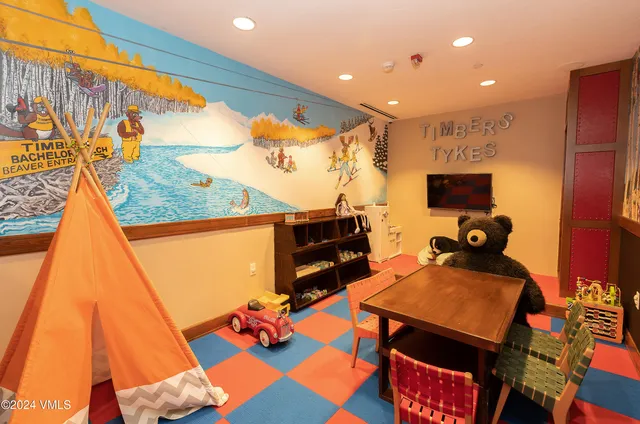 a room with furniture and air hockey table