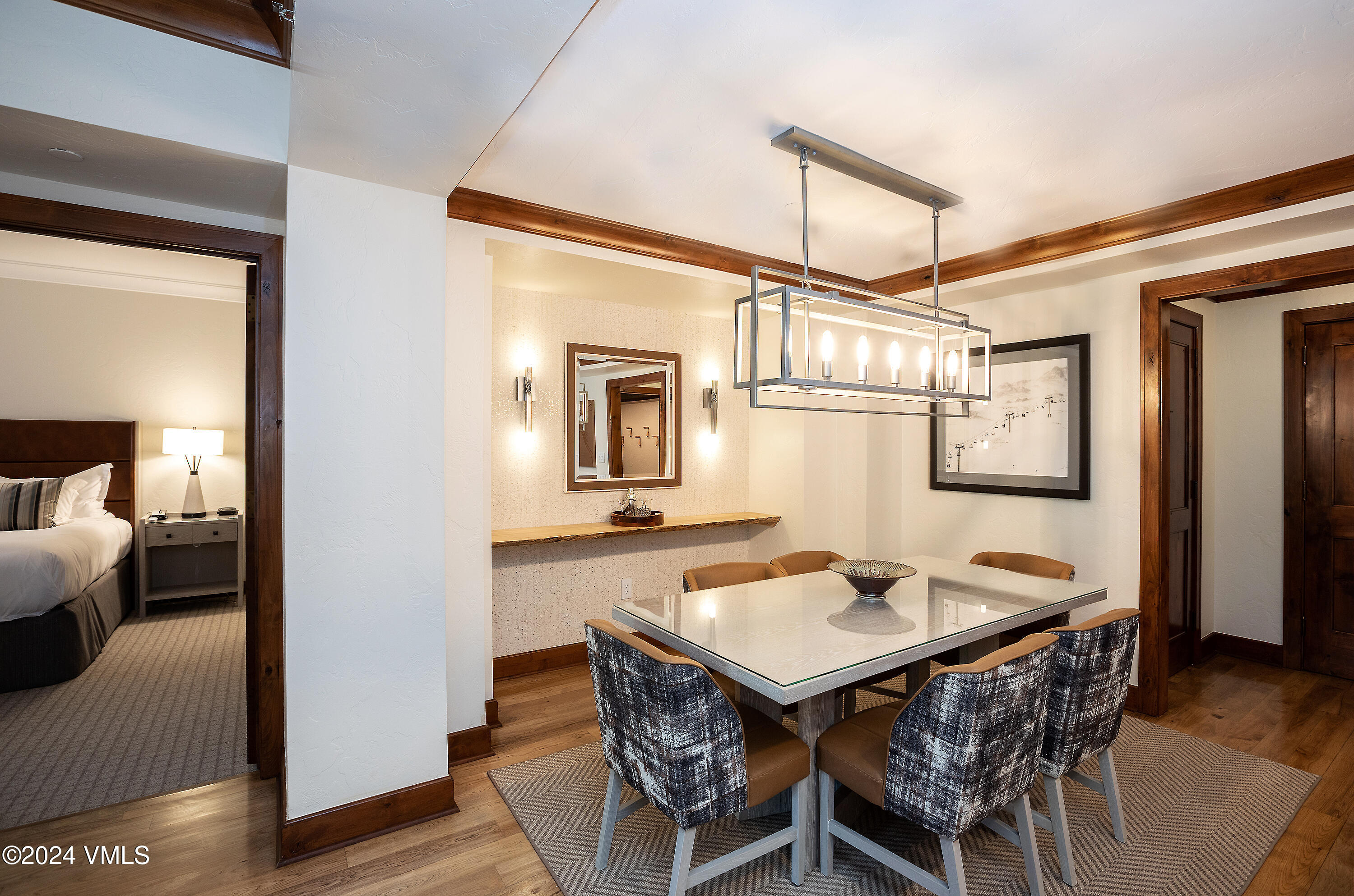 100 Bachelor Ridge Road, Unit 3208/4 Avon, CO 81620 - Photo 4 of 23 a view of a dining room with furniture and wooden floor