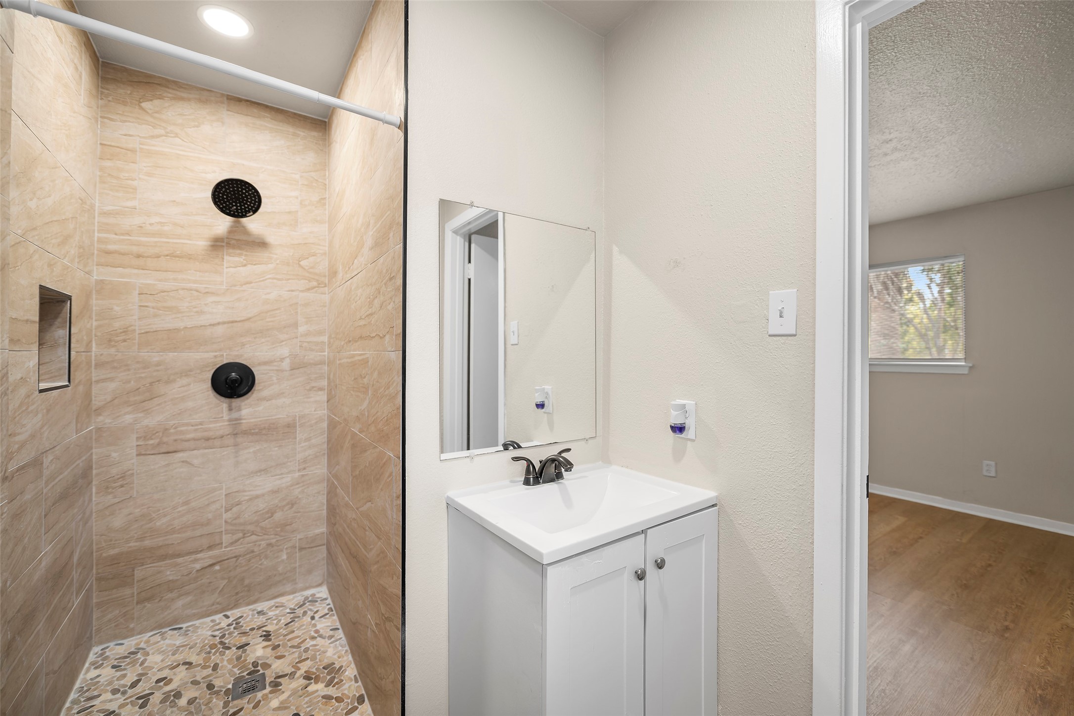 13335 Ambrose Street Houston, TX 77045 - Photo 11 of 27 primary bathroom with walk in shower