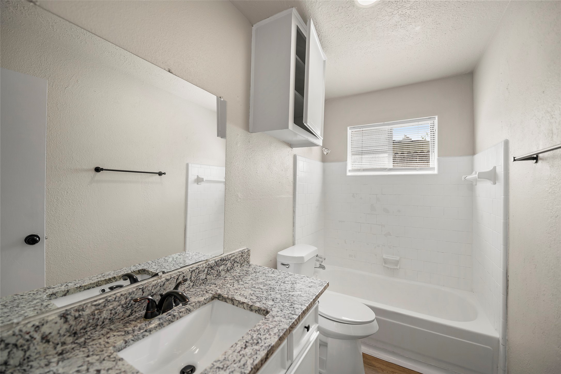 13335 Ambrose Street Houston, TX 77045 - Photo 13 of 27 secondary full bathroom includes shower and tub combo, cabinet space, natural light