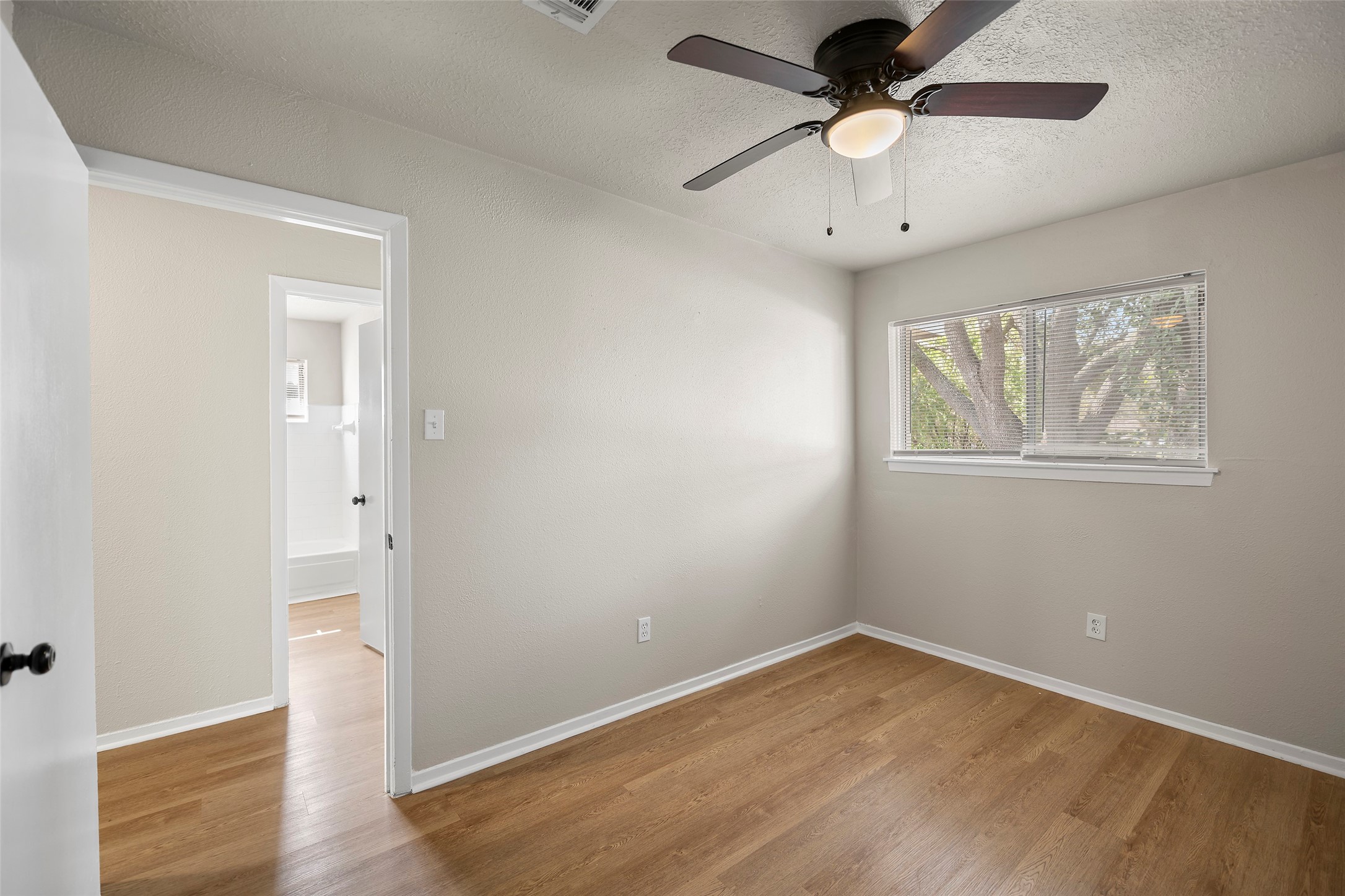 13335 Ambrose Street Houston, TX 77045 - Photo 17 of 27 another view of the third bedroom includes window and ceiling fan