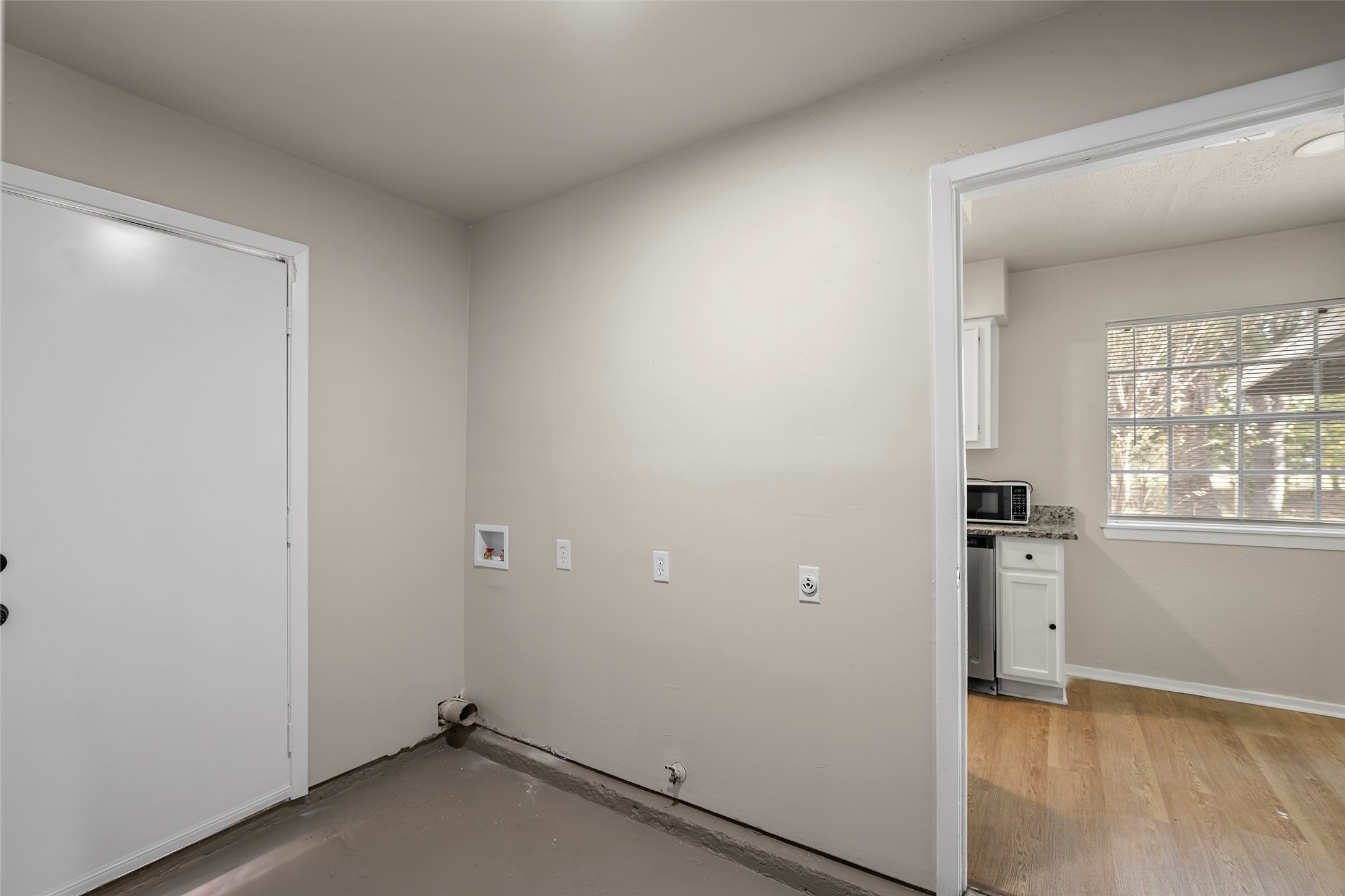13335 Ambrose Street Houston, TX 77045 - Photo 21 of 27 inside utility room facing towards kitchen/dining area