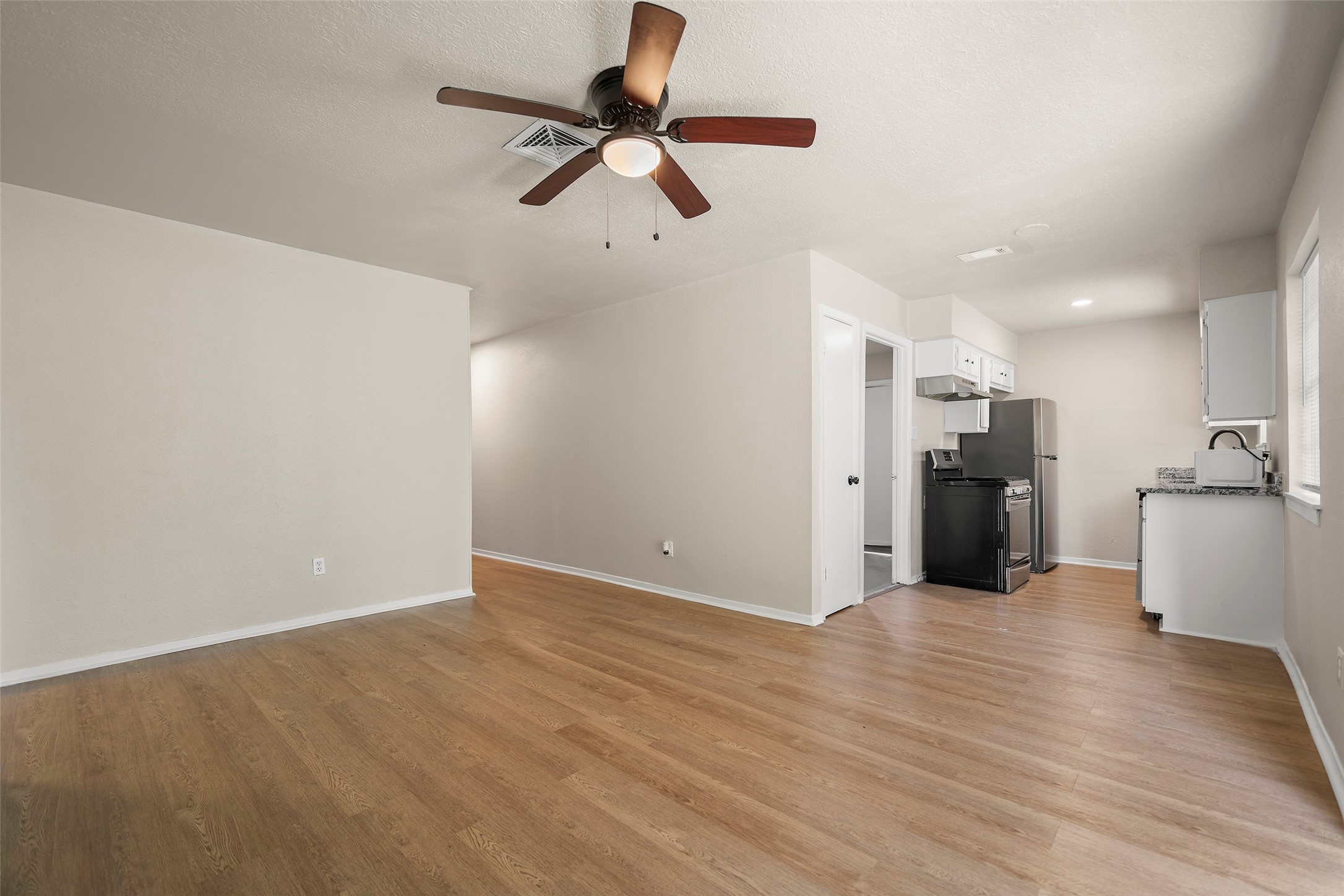 13335 Ambrose Street Houston, TX 77045 - Photo 27 of 27 view of the kitchen and living area combo open floor plan