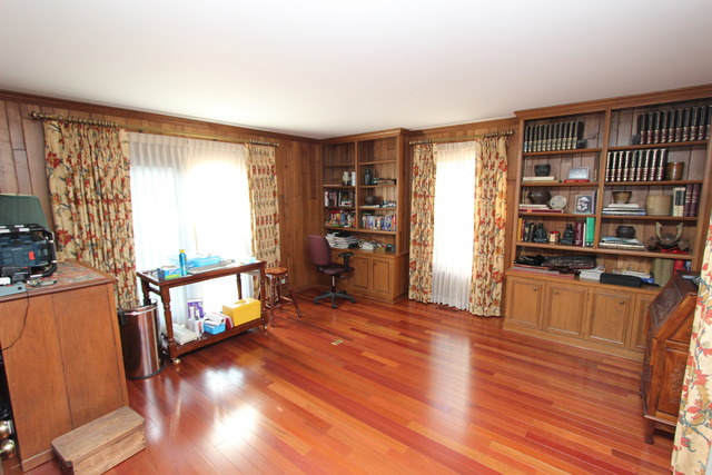 11 Deepwood Road Barrington, IL 60010 - Photo 13 of 25 a view of an empty room with wooden floor and a window
