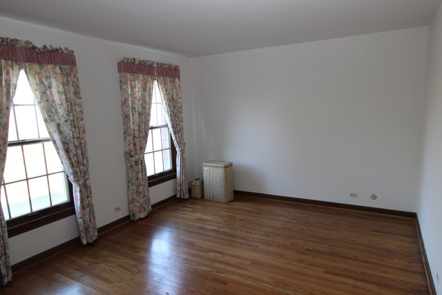 11 Deepwood Road Barrington, IL 60010 - Photo 21 of 25 an empty room with wooden floor and windows