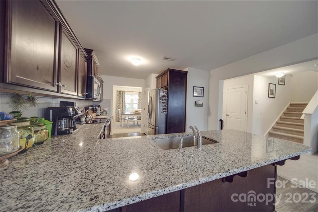 12542 Garron Road Midland, NC 28107 - Photo 25 of 38 a kitchen with lots of counter top space and stainless steel appliances