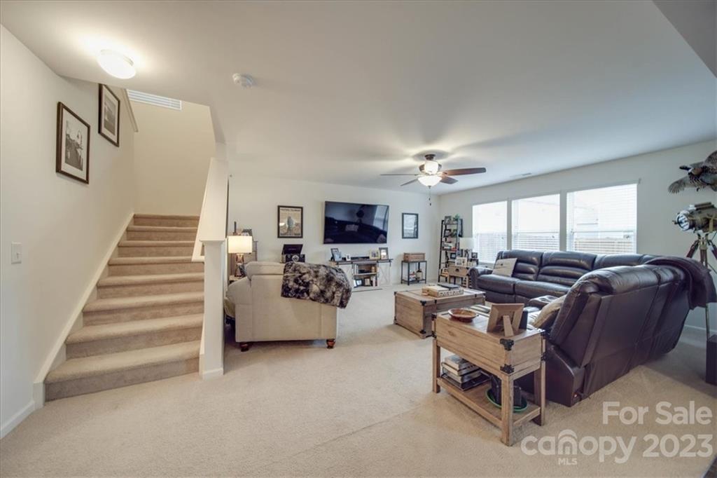 12542 Garron Road Midland, NC 28107 - Photo 30 of 38 a living room with furniture and a flat screen tv
