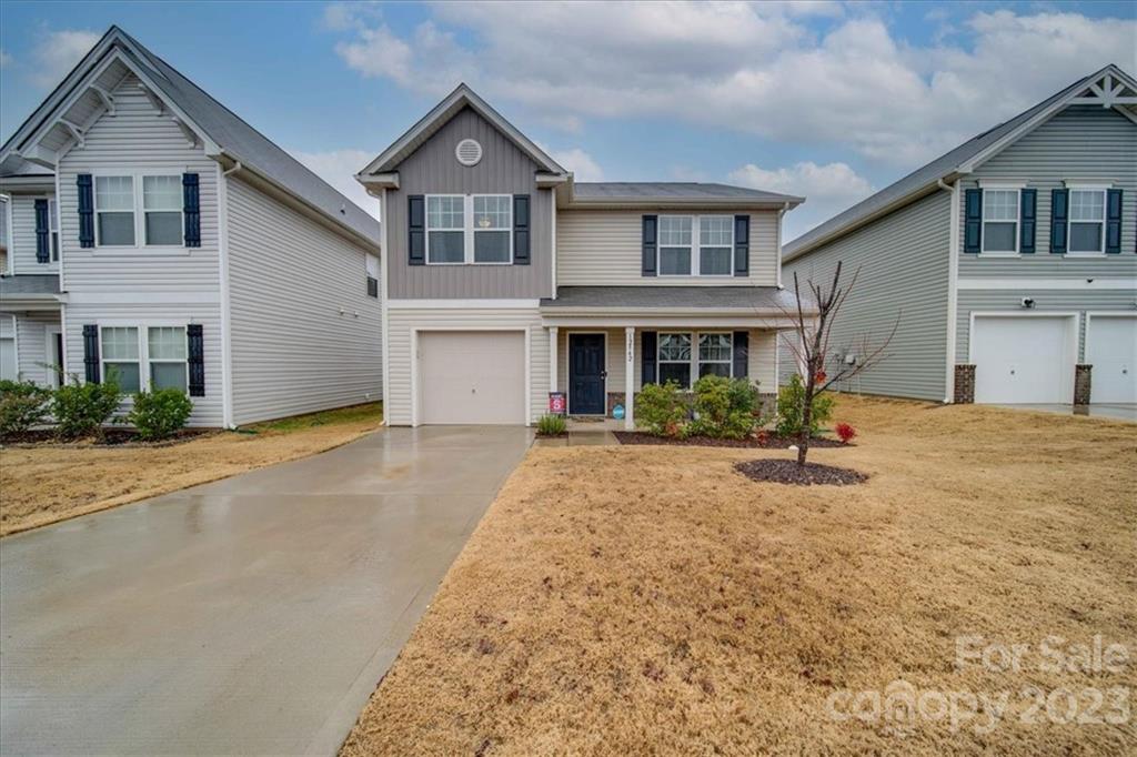 12542 Garron Road Midland, NC 28107 - Photo 3 of 38 a front view of a house with a yard