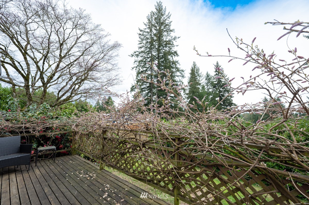 14235 169th Avenue Southeast Renton, WA 98059 - Photo 8 of 25 a view of balcony with wooden floor and bench