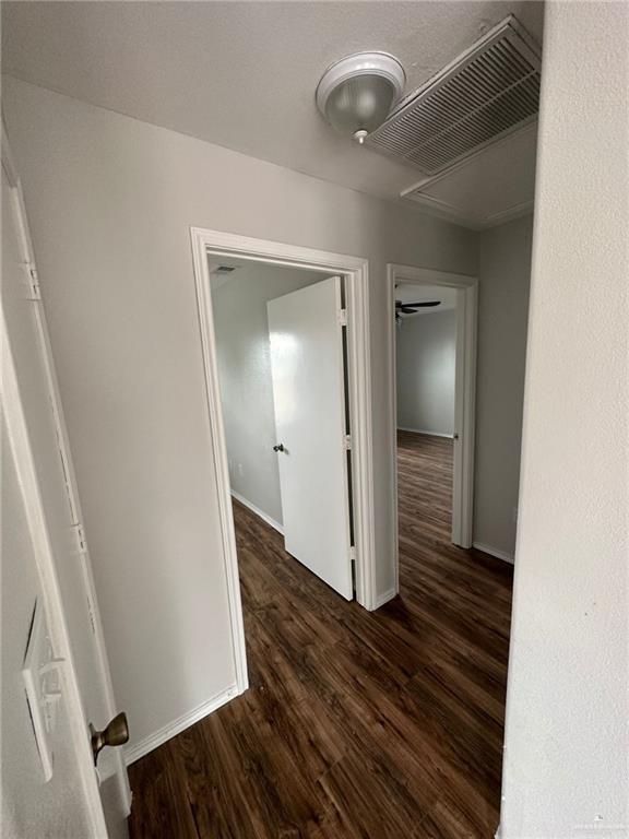 215 North 6th Street Donna, TX 78537 - Photo 14 of 16 a view of a hallway with wooden floor and staircase