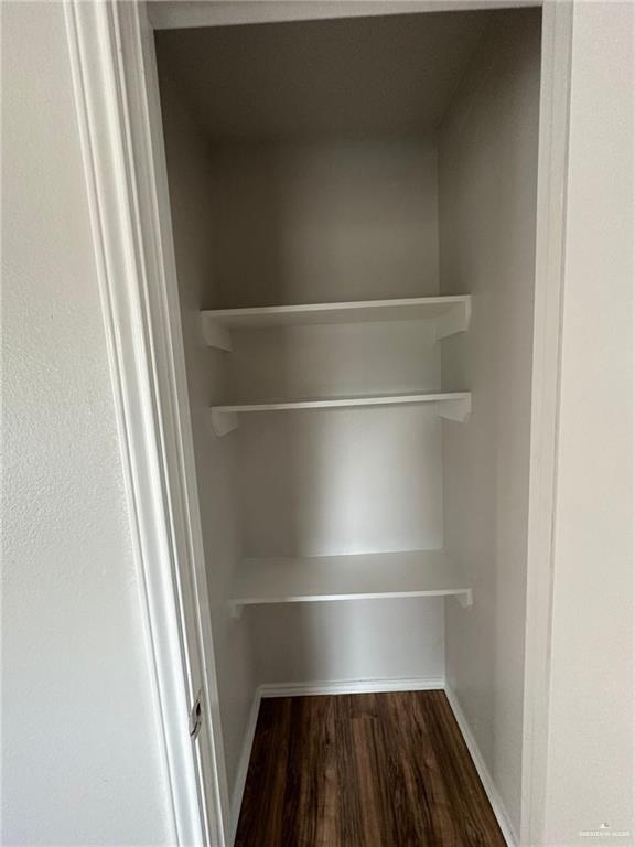 215 North 6th Street Donna, TX 78537 - Photo 3 of 16 a view of walk in closet with empty racks
