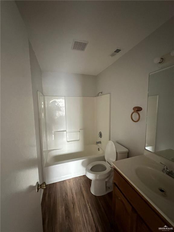215 North 6th Street Donna, TX 78537 - Photo 6 of 16 a bathroom with a granite countertop sink mirror vanity and toilet