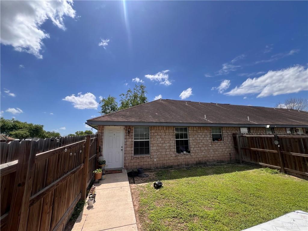 215 North 6th Street Donna, TX 78537 - Photo 9 of 16 a front view of a house having yard