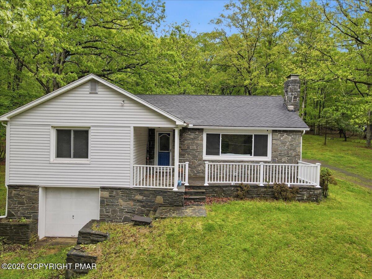 232 Garrity Road Hawley, PA 18428 - Photo 45 of 57 a house view with a garden space