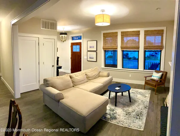 a living room with furniture rug and window