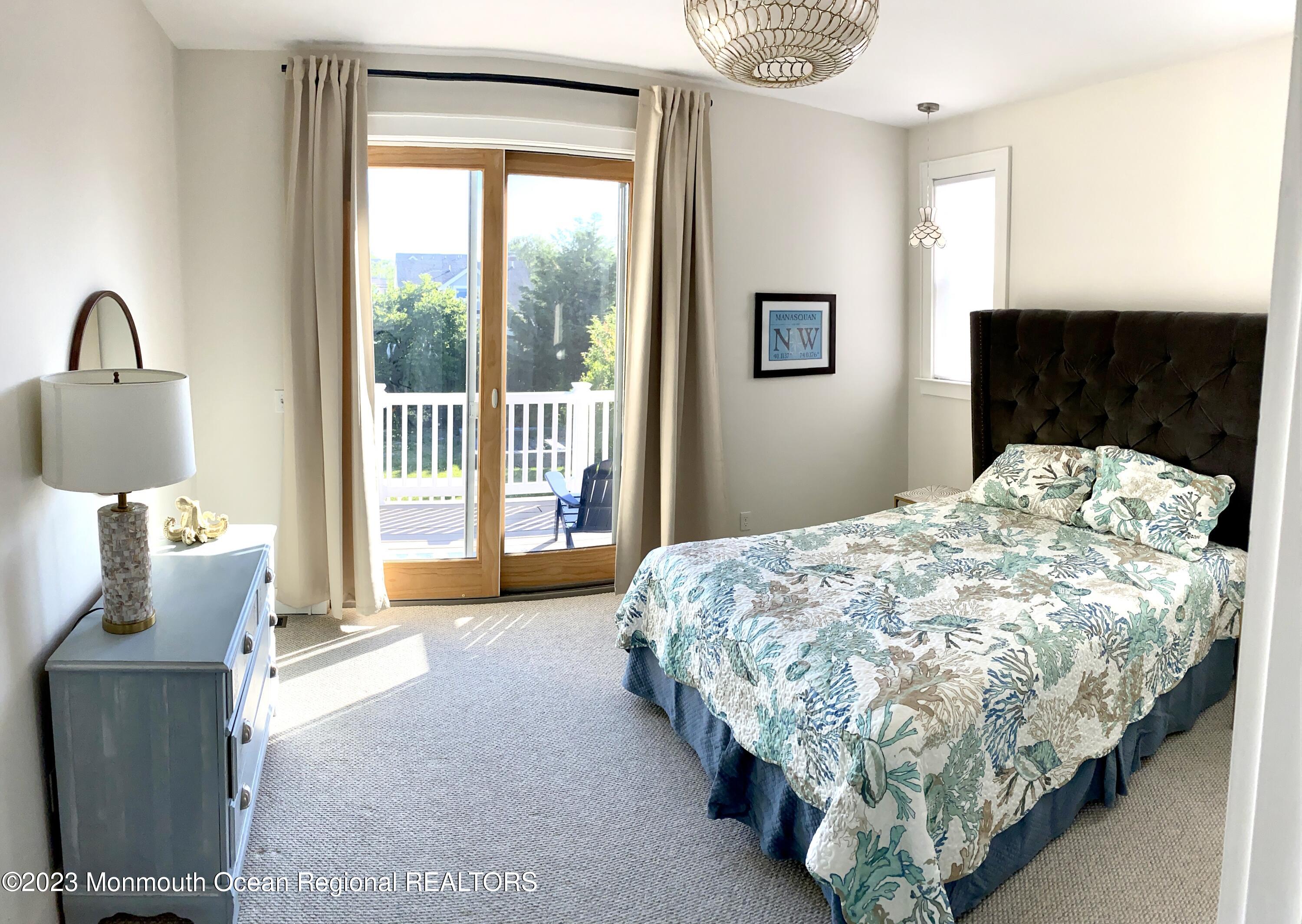 447 East Main Street Manasquan, NJ 08736 - Photo 5 of 18 a bed sitting in a bedroom next to a window