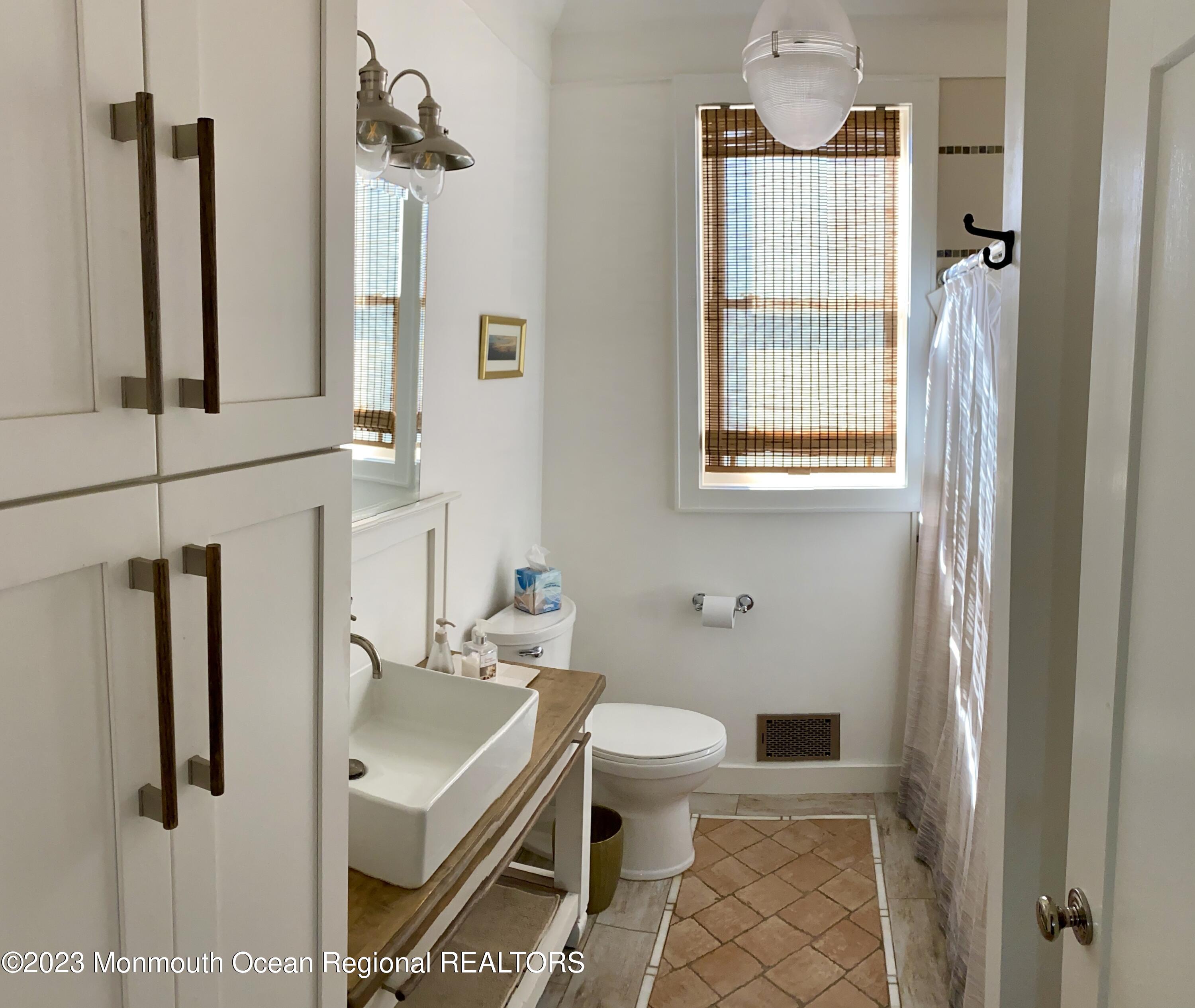 447 East Main Street Manasquan, NJ 08736 - Photo 9 of 18 a bathroom with a sink toilet and shower