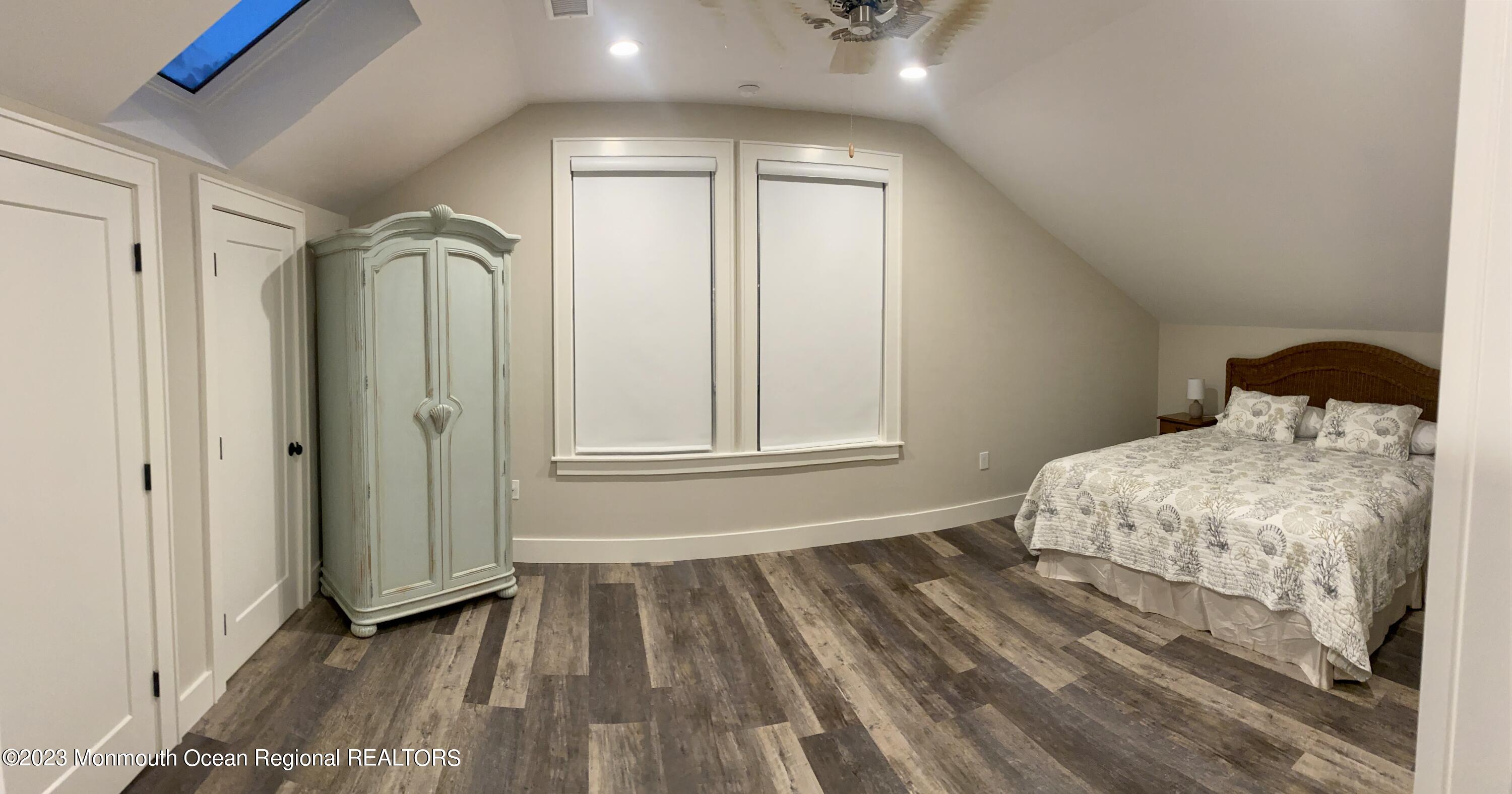 447 East Main Street Manasquan, NJ 08736 - Photo 10 of 18 a bedroom with a bed and a window