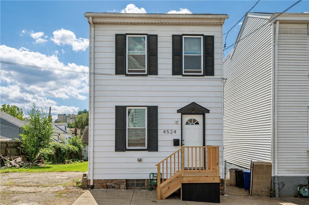 4524 Minerva Street Pittsburgh, PA 15224 - Photo 1 of 28 a front view of a house with garden