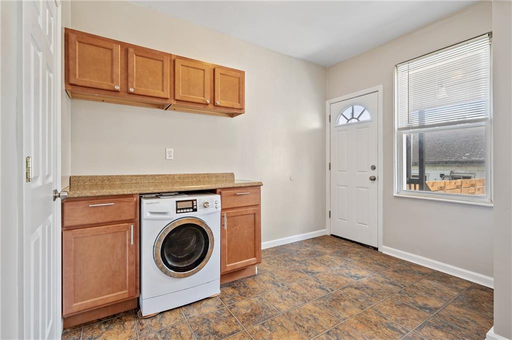 4524 Minerva Street Pittsburgh, PA 15224 - Photo 12 of 28 a utility room with dryer and washer