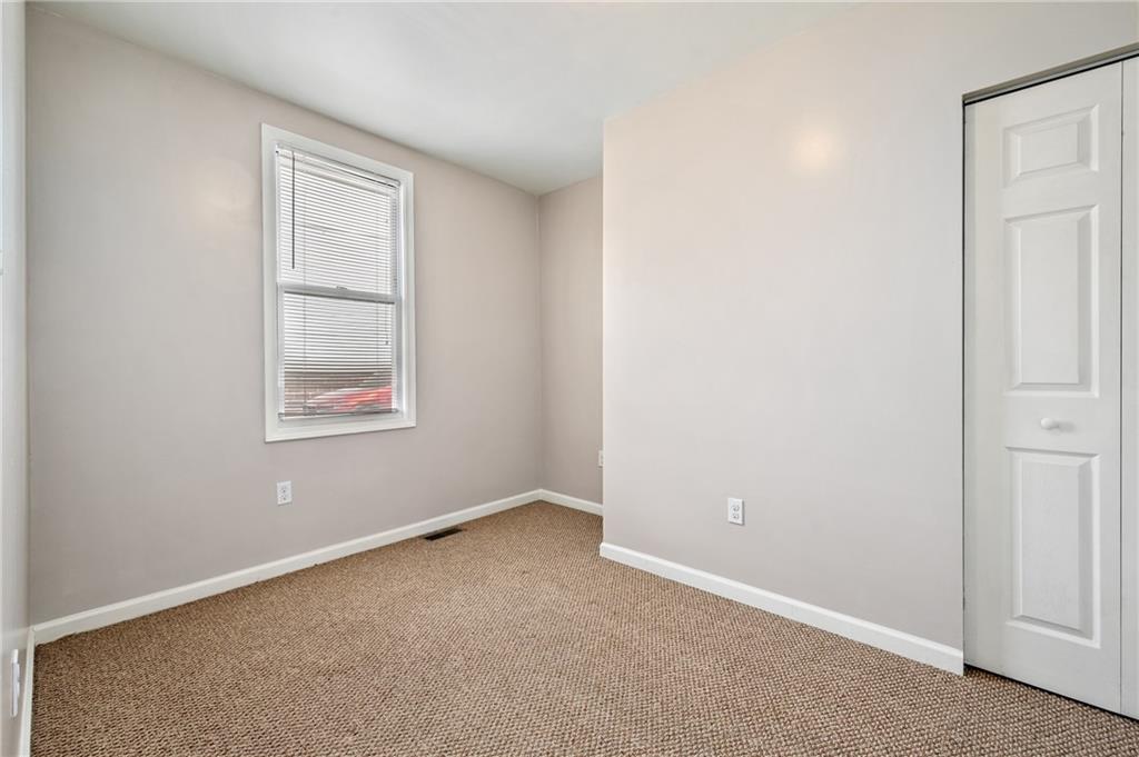 4524 Minerva Street Pittsburgh, PA 15224 - Photo 14 of 28 an empty room with windows and closet