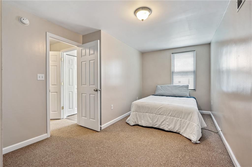 4524 Minerva Street Pittsburgh, PA 15224 - Photo 17 of 28 a bedroom with a bed and a closet