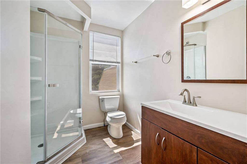 4524 Minerva Street Pittsburgh, PA 15224 - Photo 18 of 28 a bathroom with a sink a toilet and shower