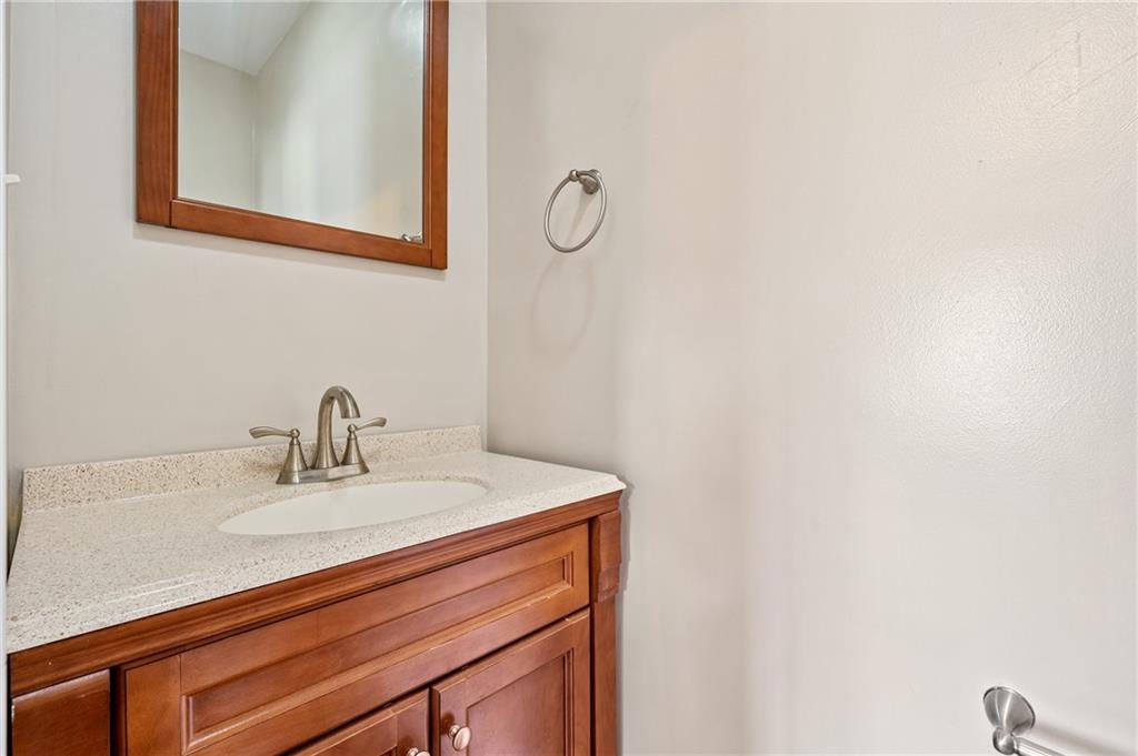 4524 Minerva Street Pittsburgh, PA 15224 - Photo 19 of 28 a bathroom with a sink and a mirror
