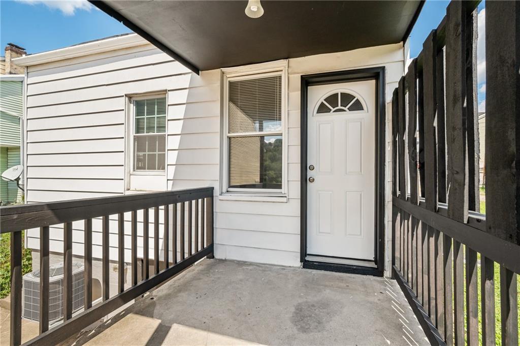 4524 Minerva Street Pittsburgh, PA 15224 - Photo 20 of 28 a view of a porch with a door and wooden floor