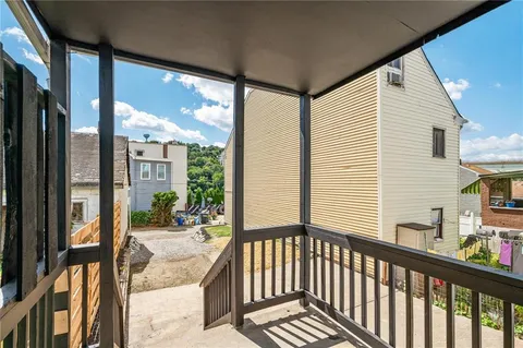 a view of balcony with a patio