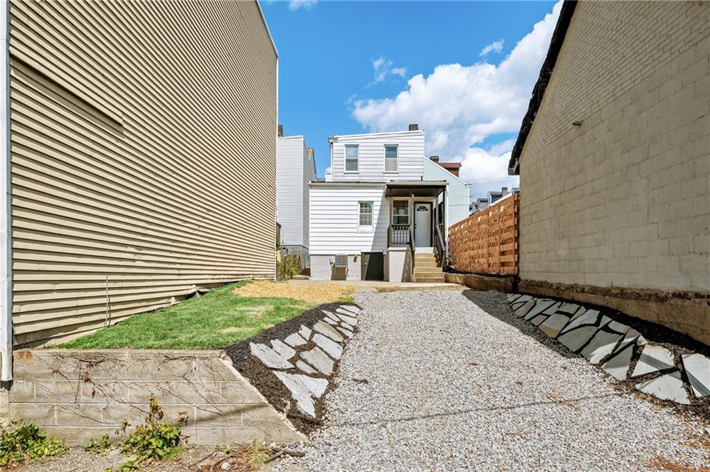 4524 Minerva Street Pittsburgh, PA 15224 - Photo 24 of 28 a view of a house with backyard and sitting area