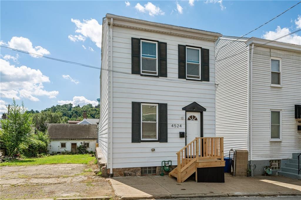 4524 Minerva Street Pittsburgh, PA 15224 - Photo 28 of 28 a front view of a house with a yard