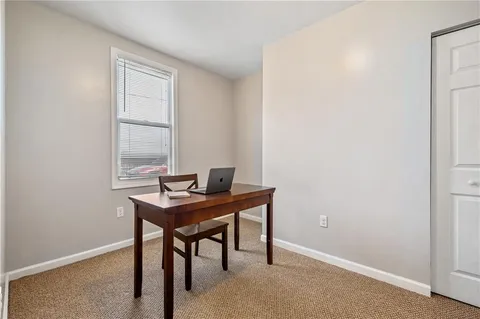 a view of a workspace with furniture