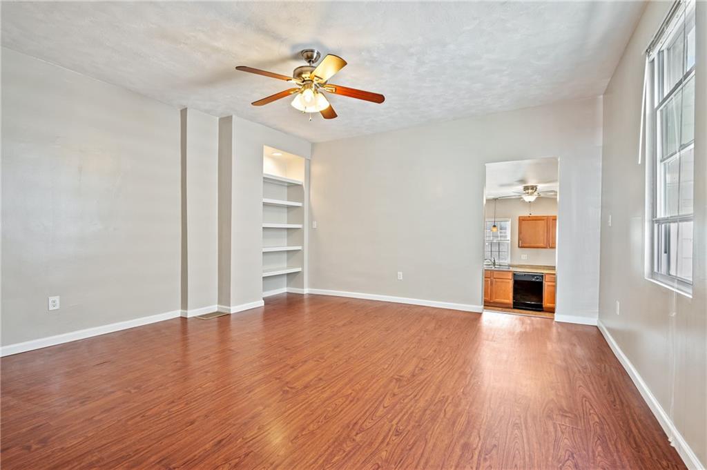 4524 Minerva Street Pittsburgh, PA 15224 - Photo 5 of 28 an empty room with wooden floor chandelier and entryway