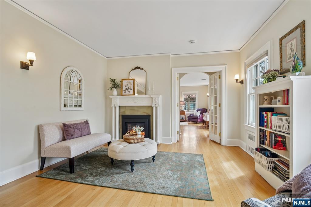 29 Hillcrest Road Glen Ridge, NJ 07028 - Photo 27 of 44 a living room with furniture and a fireplace