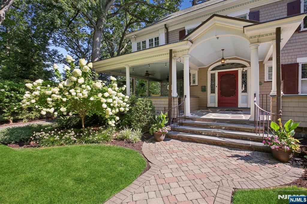 29 Hillcrest Road Glen Ridge, NJ 07028 - Photo 3 of 44 a front view of a house with a porch
