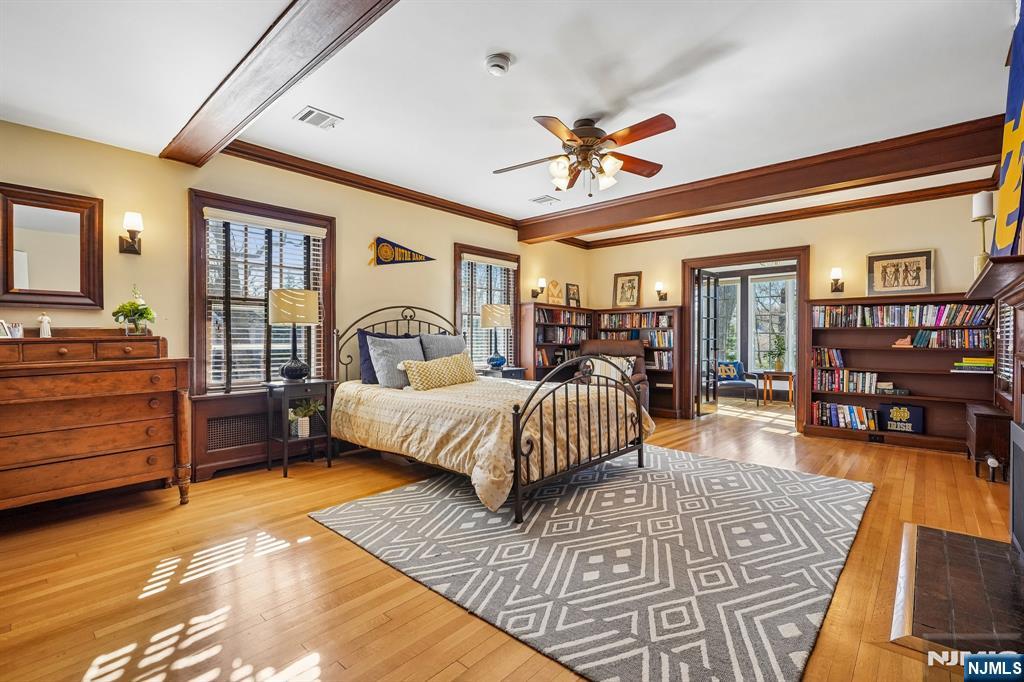 29 Hillcrest Road Glen Ridge, NJ 07028 - Photo 34 of 44 a bedroom with a bed and wooden floor