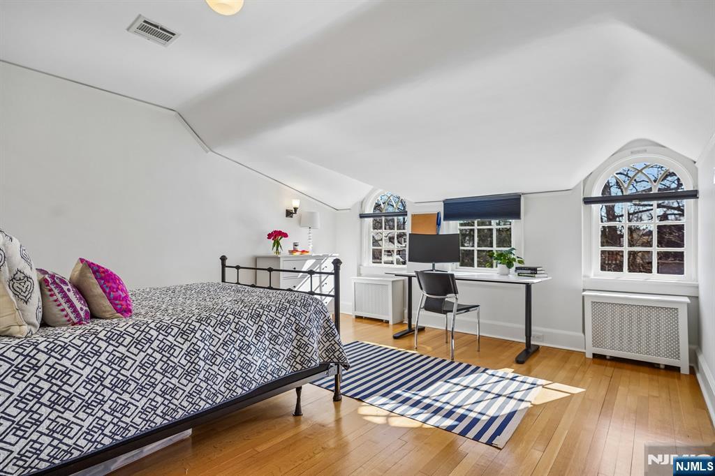 29 Hillcrest Road Glen Ridge, NJ 07028 - Photo 36 of 44 a bedroom with furniture and a wooden floor