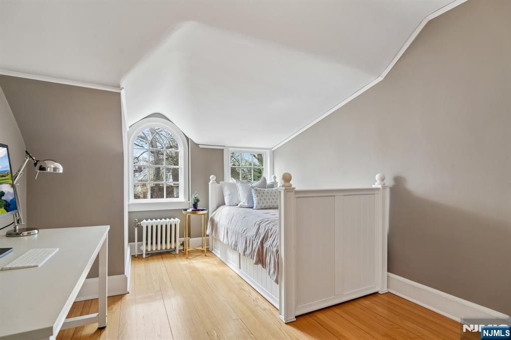 29 Hillcrest Road Glen Ridge, NJ 07028 - Photo 38 of 44 a view of a bedroom with wooden floor and windows