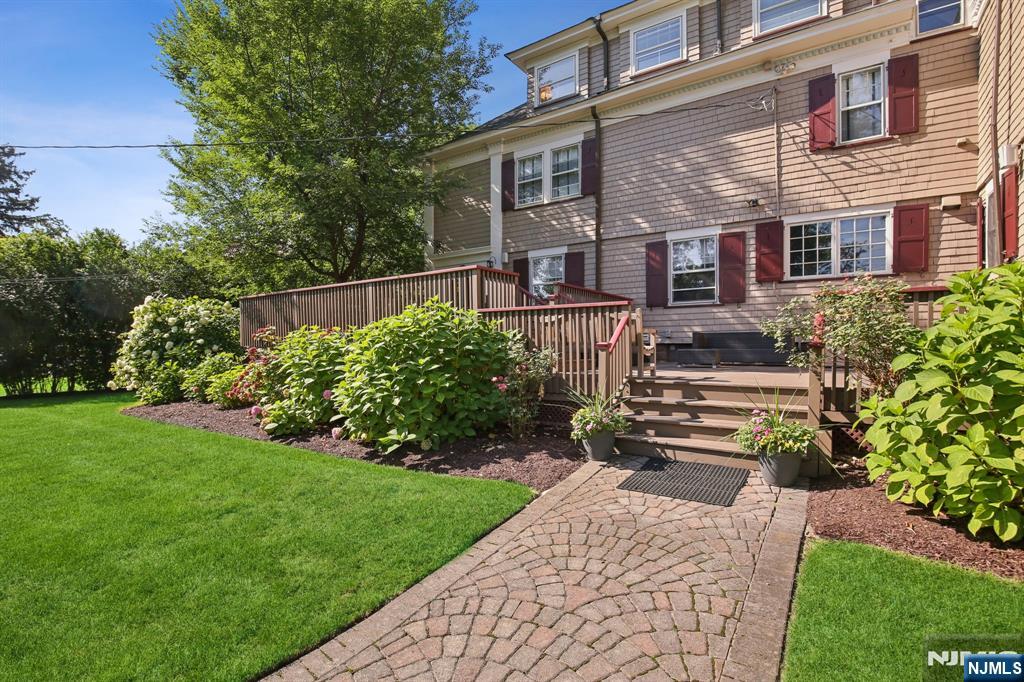 29 Hillcrest Road Glen Ridge, NJ 07028 - Photo 42 of 44 front view of a house with a yard