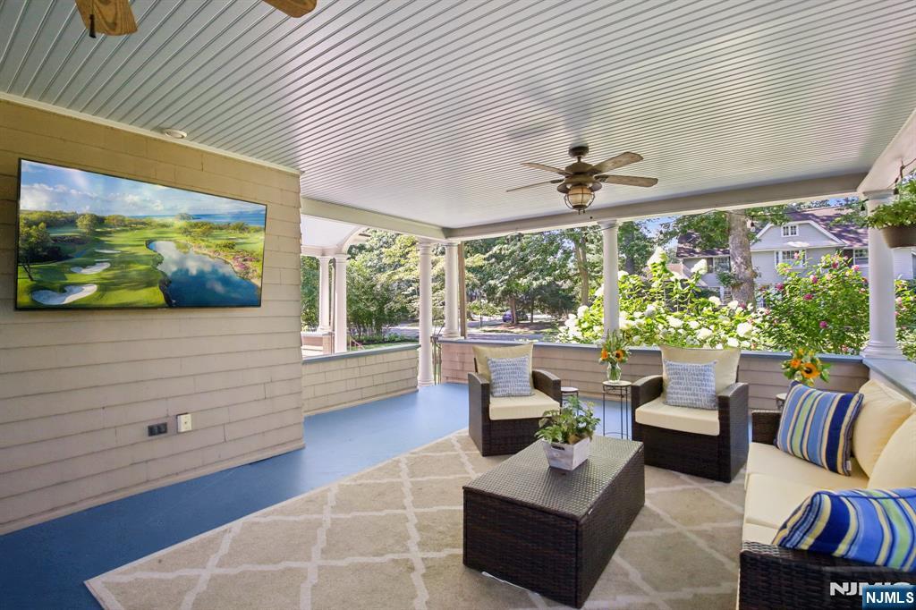 29 Hillcrest Road Glen Ridge, NJ 07028 - Photo 5 of 44 a living room with patio furniture and a floor to ceiling window