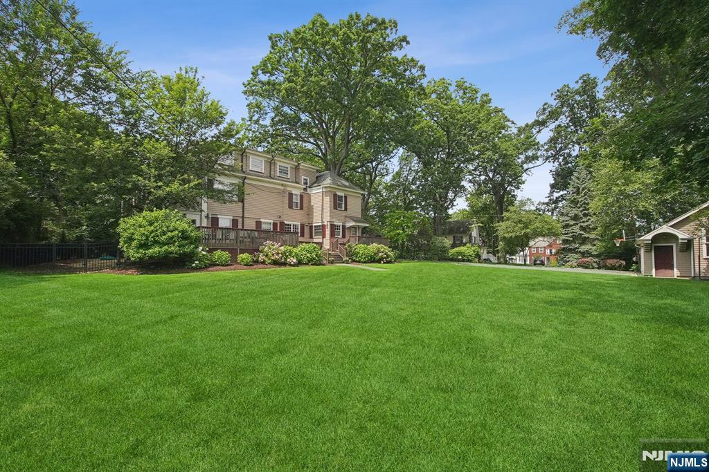 29 Hillcrest Road Glen Ridge, NJ 07028 - Photo 10 of 44 a front view of a house with a yard