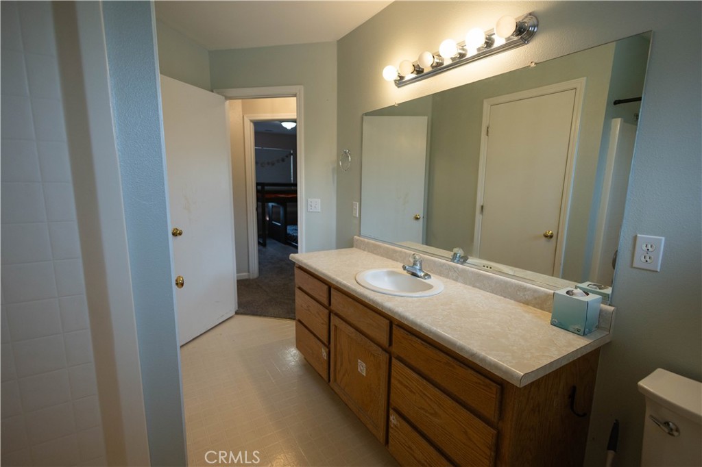 6042 Grange Road Corning, CA 96021 - Photo 19 of 38 a bathroom with a sink and a mirror