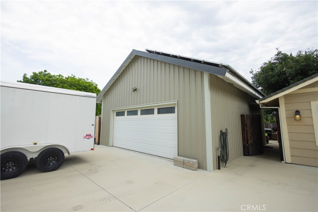 6042 Grange Road Corning, CA 96021 - Photo 2 of 38 a view of garage and a car parked in it