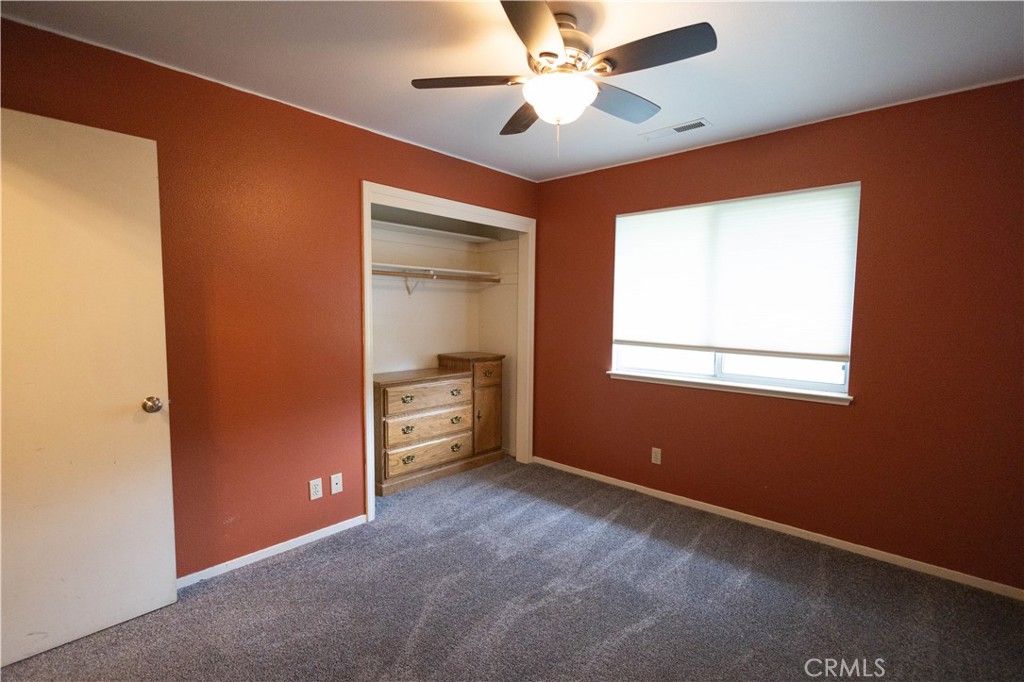 6042 Grange Road Corning, CA 96021 - Photo 22 of 38 an empty room with closet and fan