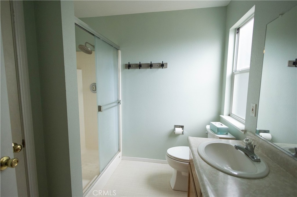 6042 Grange Road Corning, CA 96021 - Photo 25 of 38 a bathroom with a sink toilet and shower