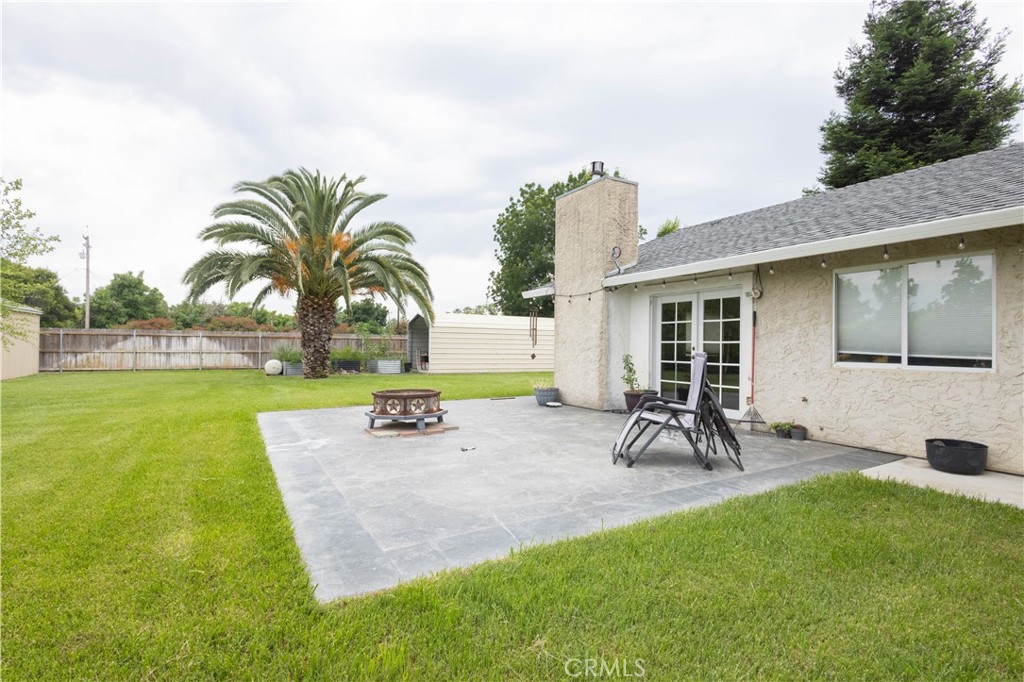 6042 Grange Road Corning, CA 96021 - Photo 30 of 38 a view of a backyard with a patio