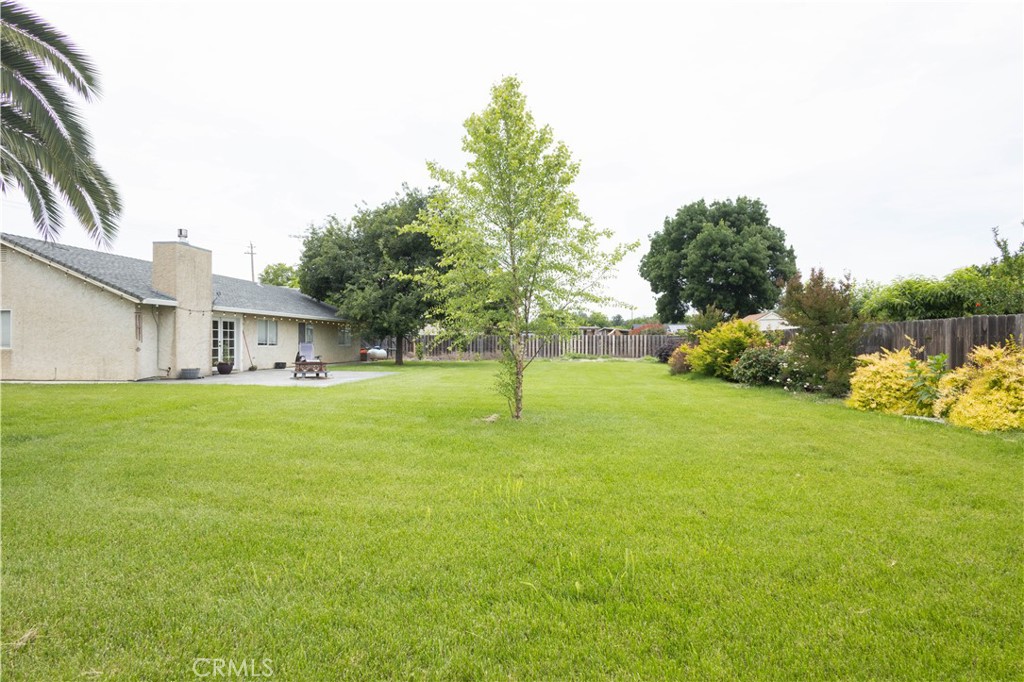 6042 Grange Road Corning, CA 96021 - Photo 35 of 38 a view of a house with a yard