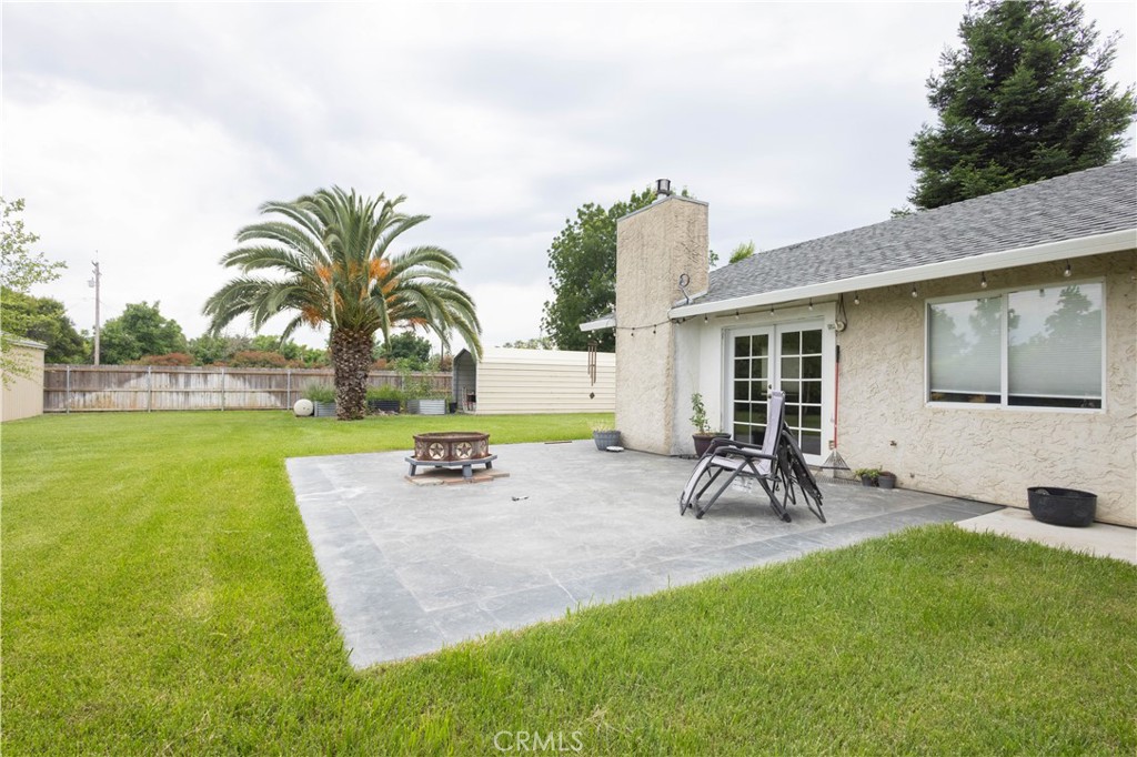 6042 Grange Road Corning, CA 96021 - Photo 37 of 38 a view of a backyard with a patio
