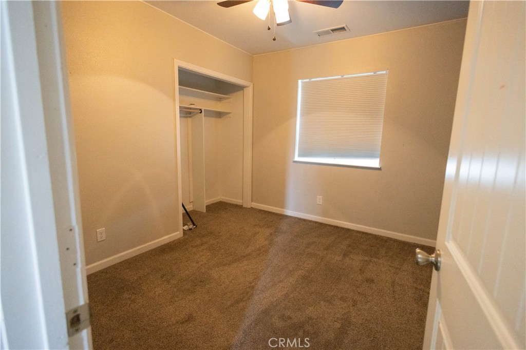 6042 Grange Road Corning, CA 96021 - Photo 6 of 38 a view of an empty room with a window